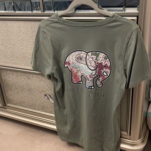 It’s ivory Ella size S dark green tee